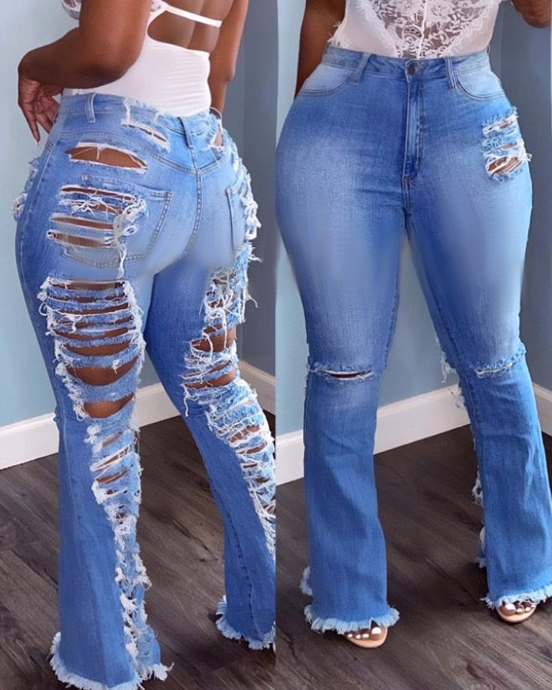 Jeans bootcut rasgados con cremallera y dobladillo sin rematar